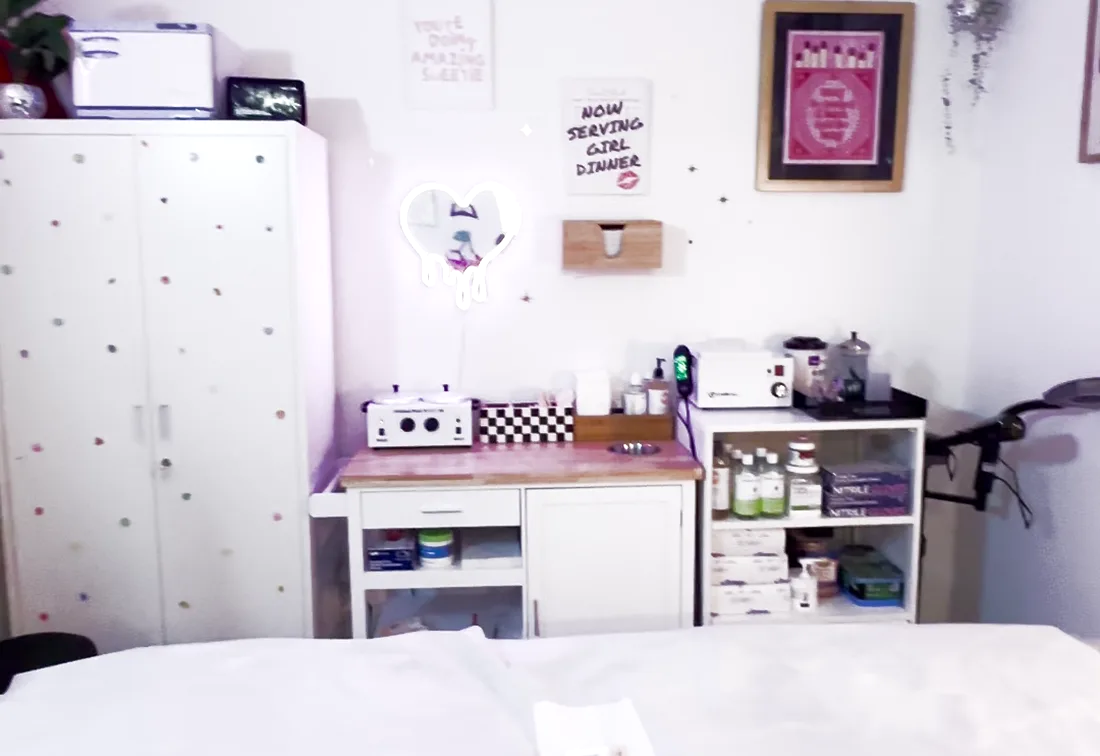 Brand New Beauty's private treatment room with a clean, linen-covered waxing bed and tidy single-use supplies